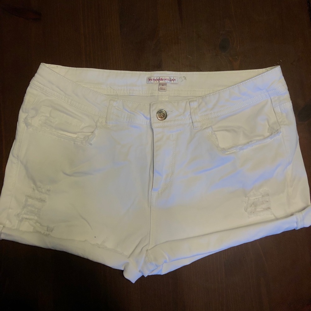 white distressed shorts.